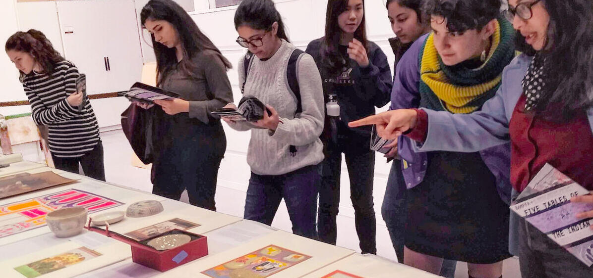 students looking at art display